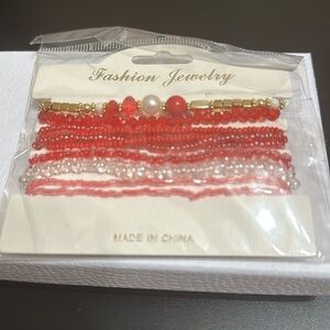 Brand new! Ten red stackable stretchy bracelets. Boho look